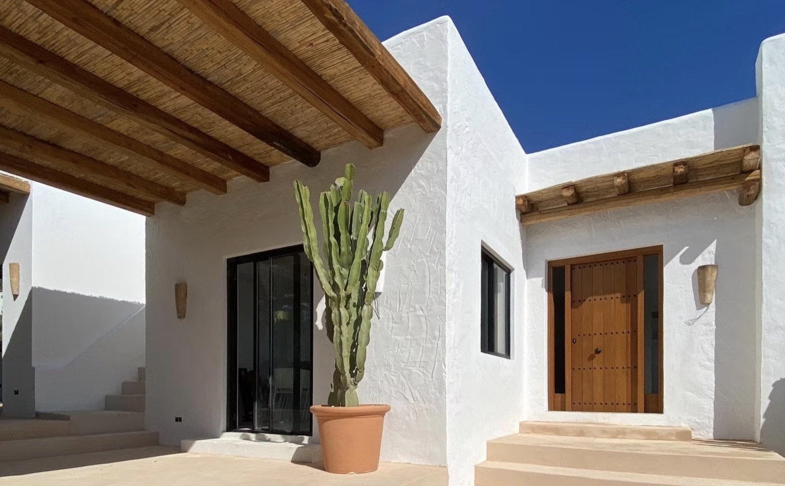 Ibiza courtyard architecture in white and natural timber