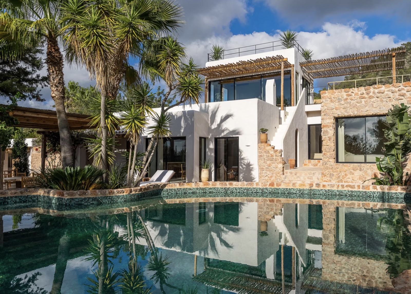 Mediterranean residence reflected in its pool