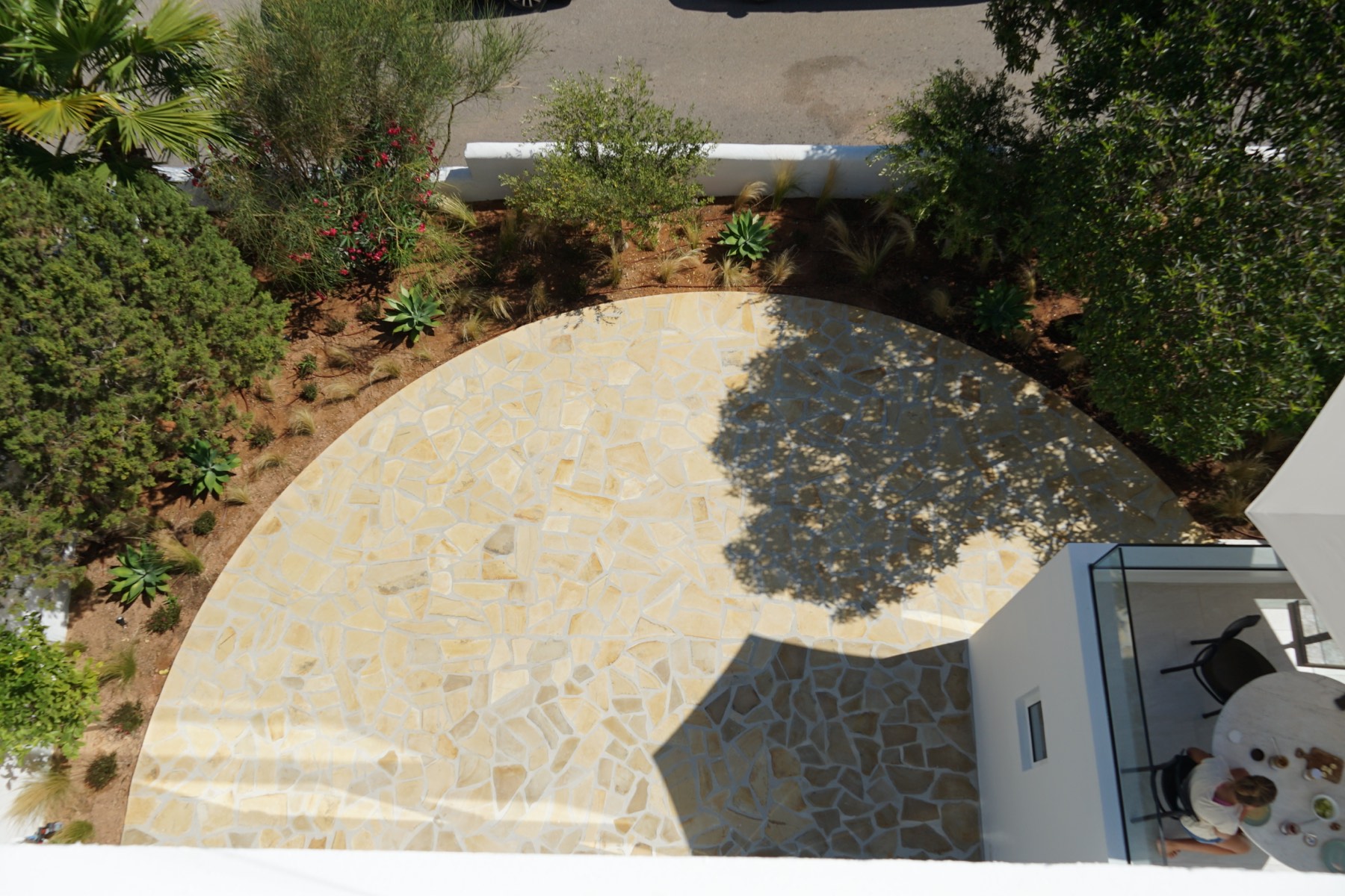 Mediterranean garden and stone terrace at Casa Vista Mar in Ibiza
